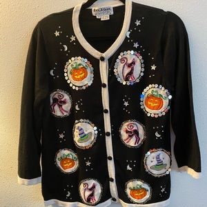 Get in time for Halloween. Fun cardigan with scary decorations